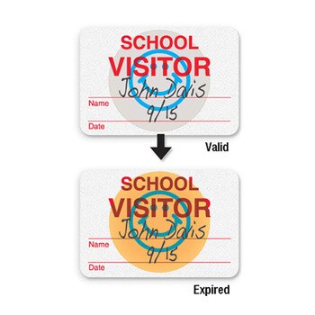 School visitor badge with blue smiley, changes color on expiring